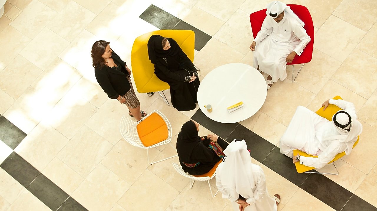 Casual meeting in building reception