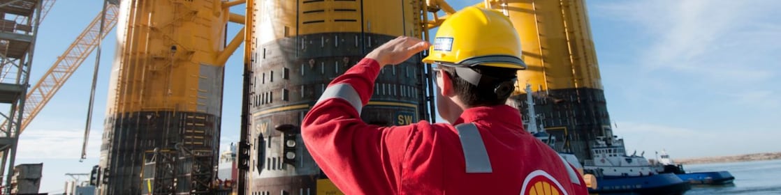 Engineer looking up at platform under construction