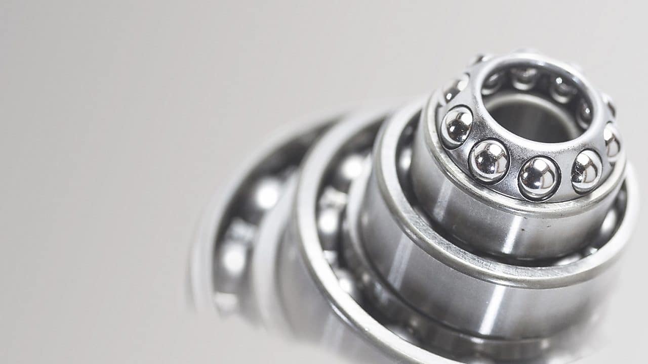 Metal cylinder with ball bearings in