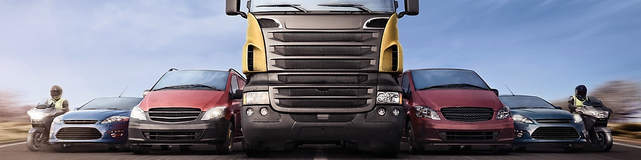 Motorcycles, cars and trucks on road