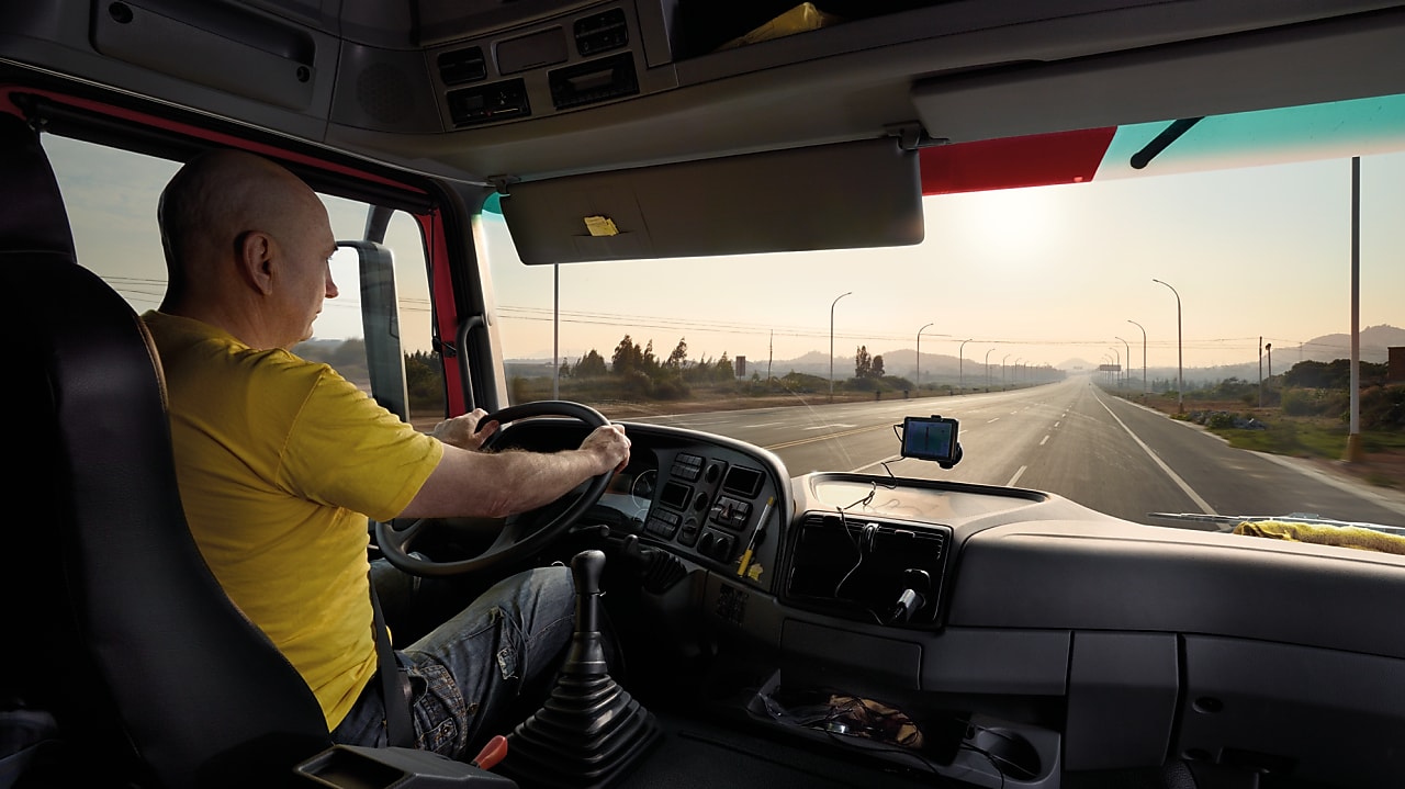 truck driver driving on empty road