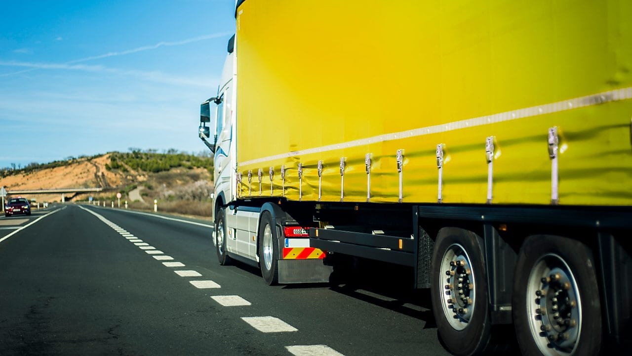 Yellow truck on the road