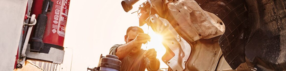 man-checking-truck-engine