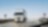 road with two heavy trucks coming