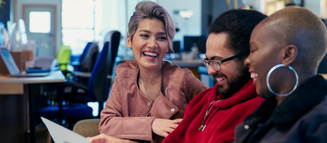 Laughing creative business people in office