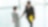 Businessman and businesswoman shaking hands in lobby