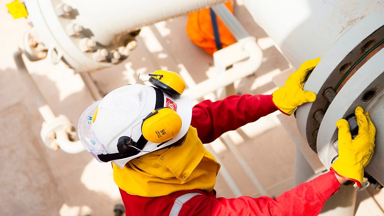 Worker wearing safety mask and gloves