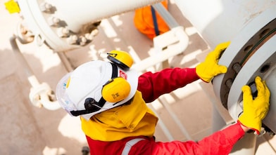 Worker wearing safety mask and gloves