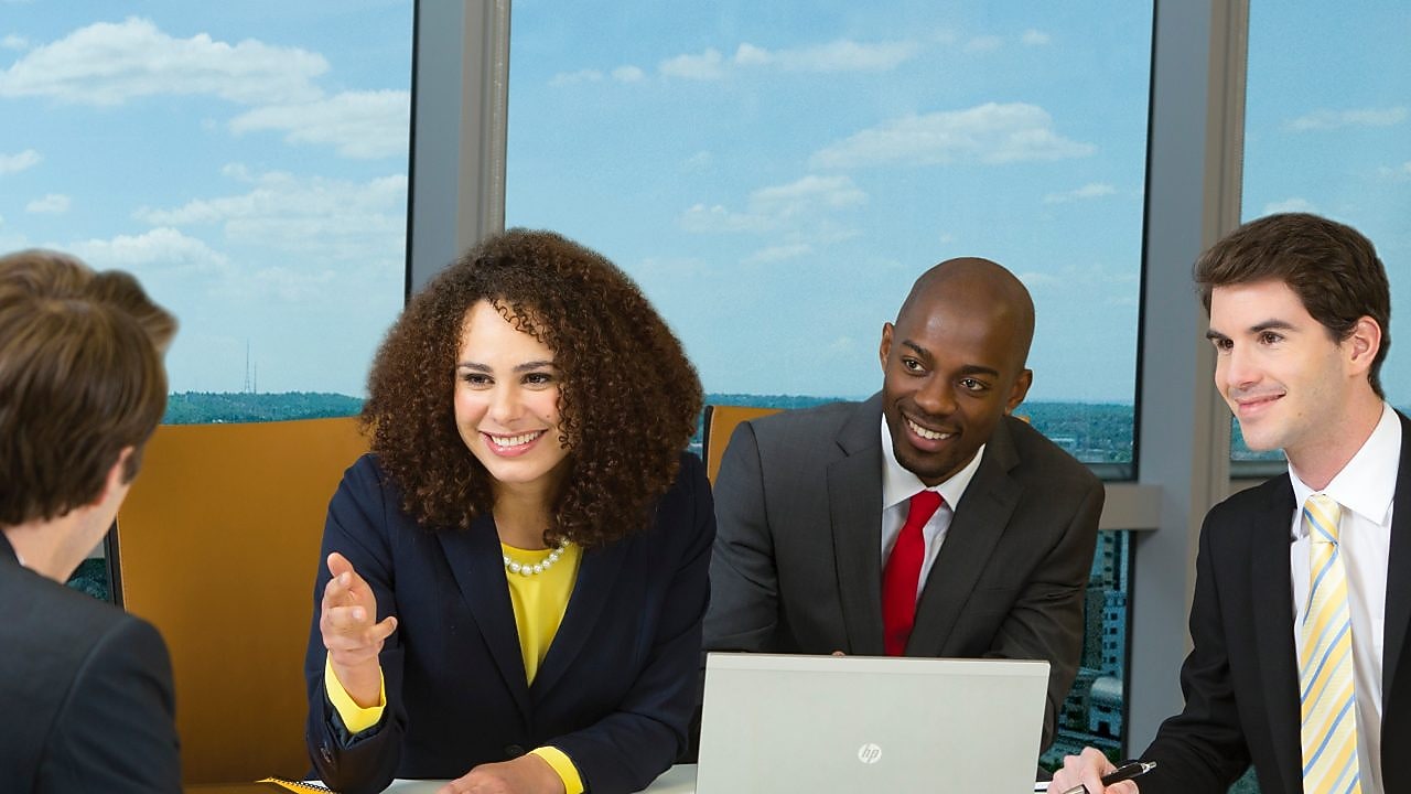 four shell employees in a meeting 