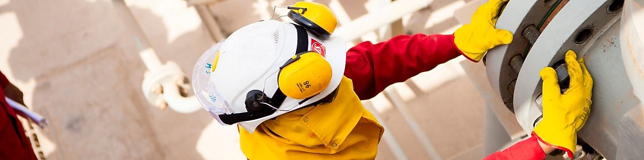 Worker wearing safety mask and gloves