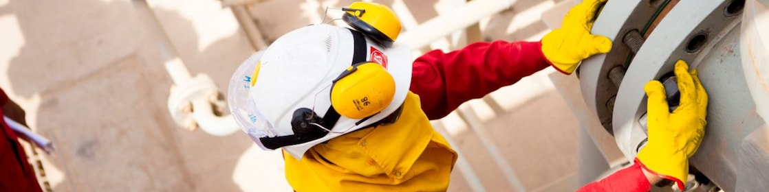 Worker wearing safety mask and gloves