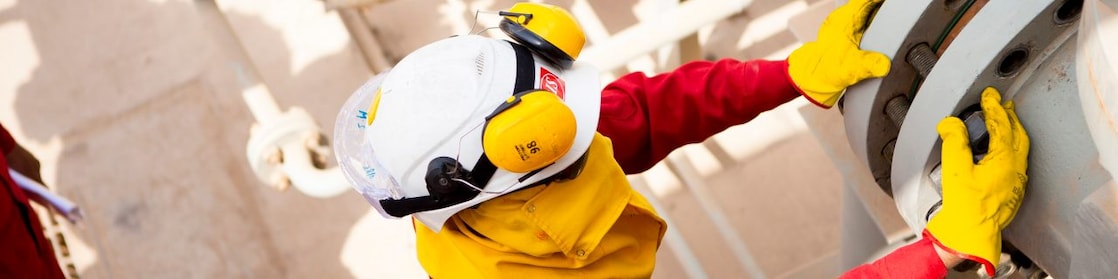 Worker wearing safety mask and gloves
