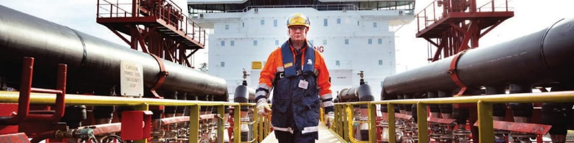 worker walking around a Shell vessel