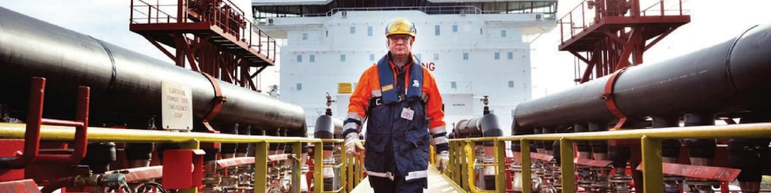 worker walking around a Shell vessel