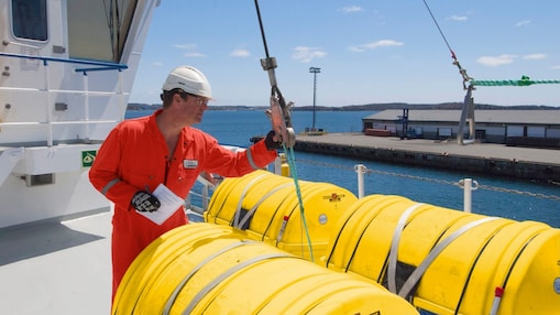 Employee standing in red dress