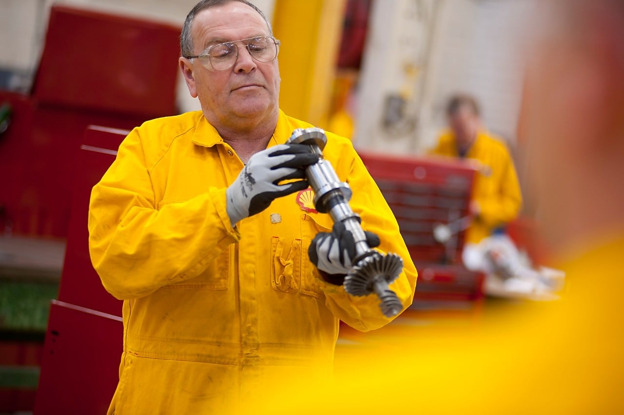 Worker inspecting a piece of equipment