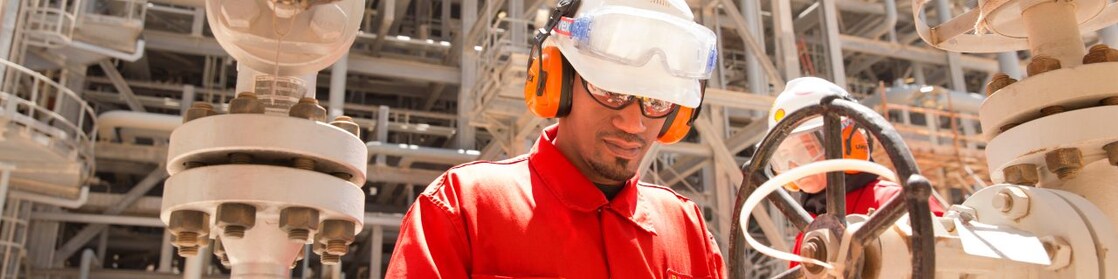 worker checking a valve