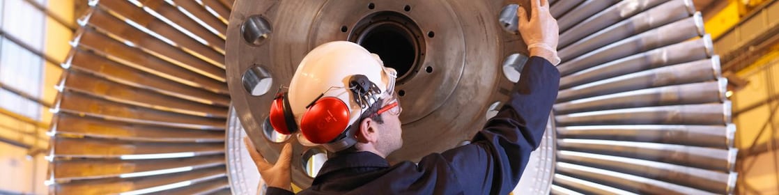 Engineer Inspecting Turbine