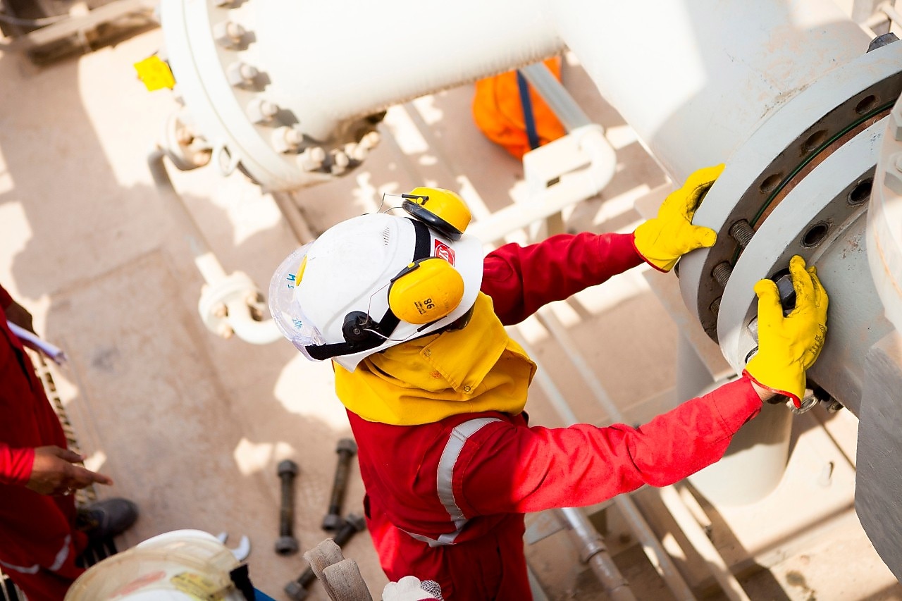 Worker wearing safety mask and gloves